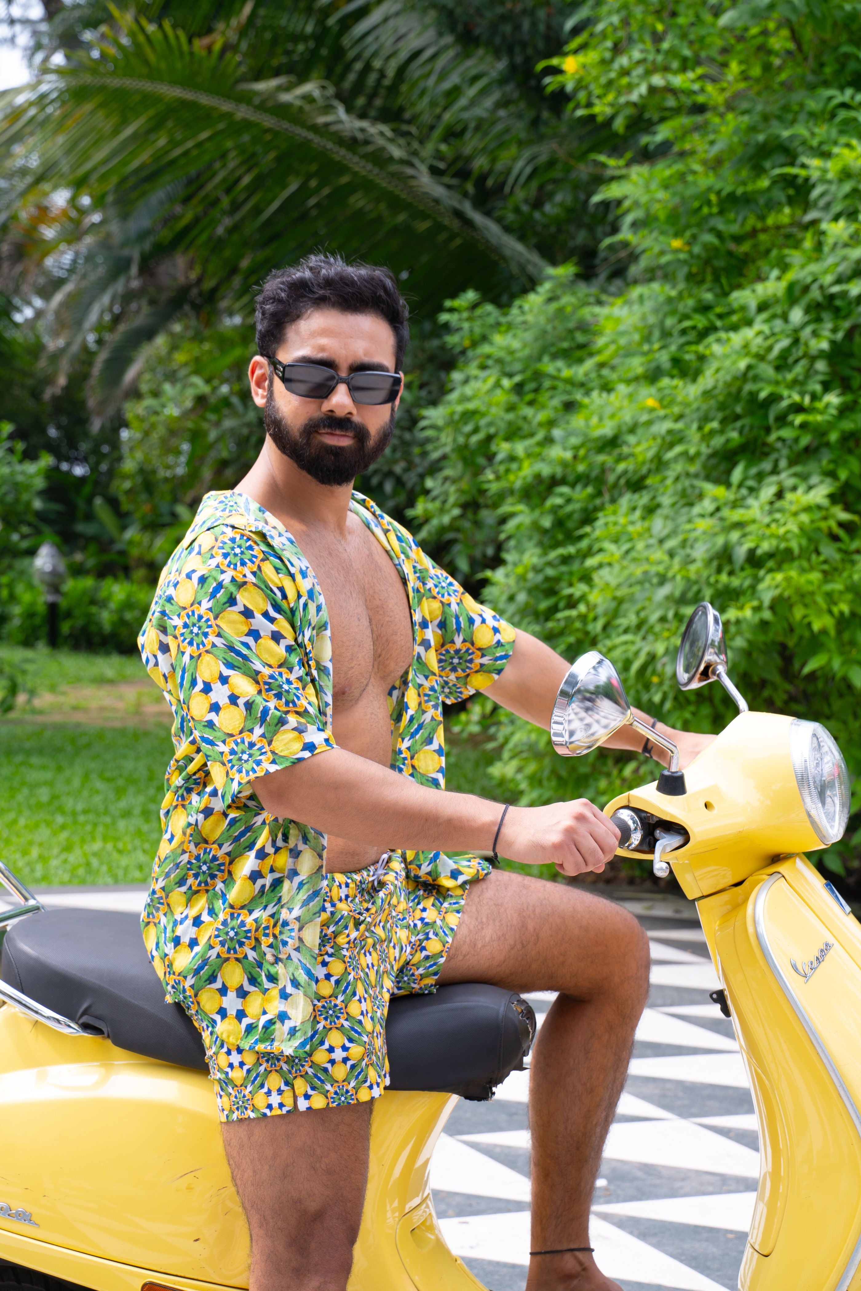 Designer Amalfi men's swimwear shorts in quick-dry printed fabric with adjustable drawstring, elastic waistband, plus sizes and matching family set. Ideal for beach days and resort wear styling.