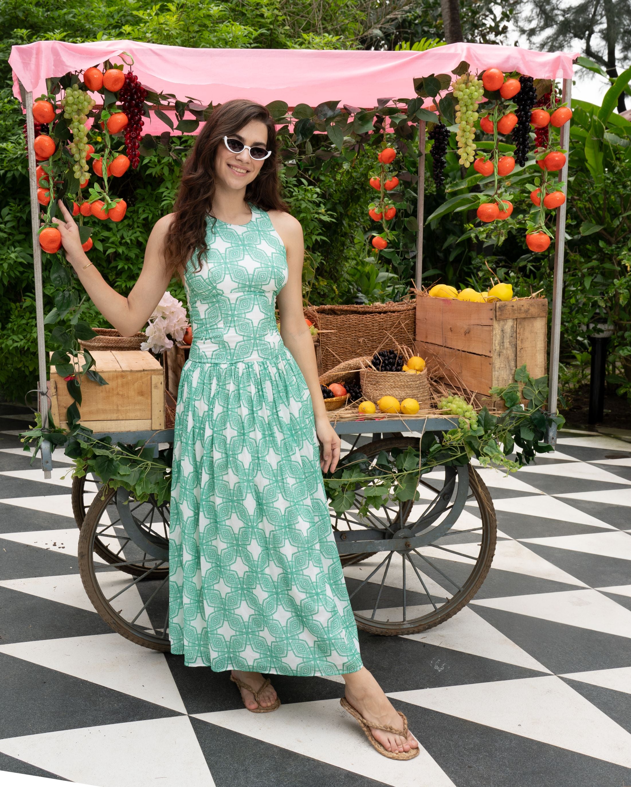 Designer Milano beach dress for women in sustainable, green quick-dry fabric, with halter neck design and plus sizes. Stylish, comfortable beachwear for holiday outings.