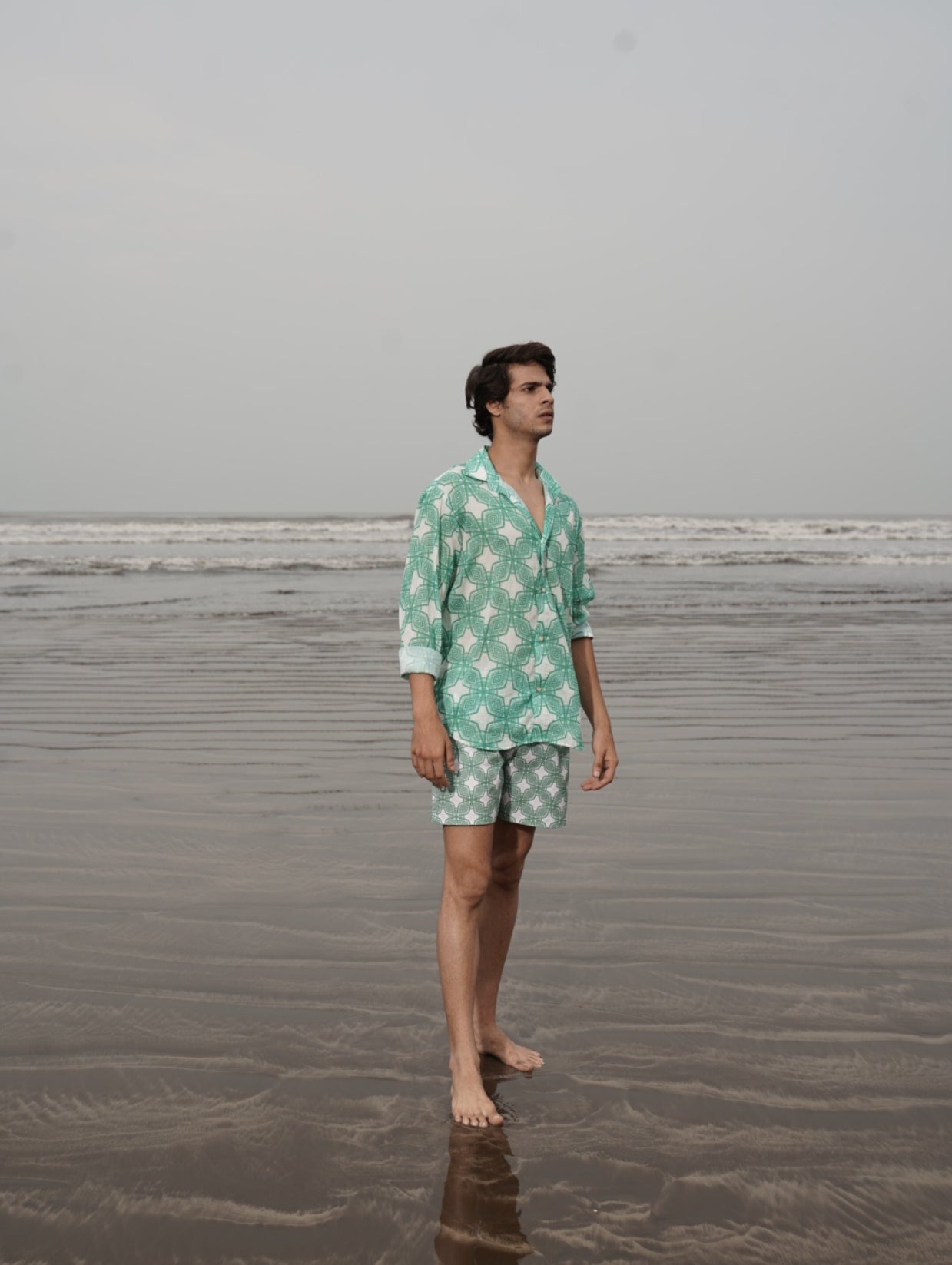 Designer Milano beach shirt for men in sustainable, quick-dry green printed fabric, full sleeves for sun protection, custom fit, plus sizes and matching family set. Comfortable beachwear for summer outings