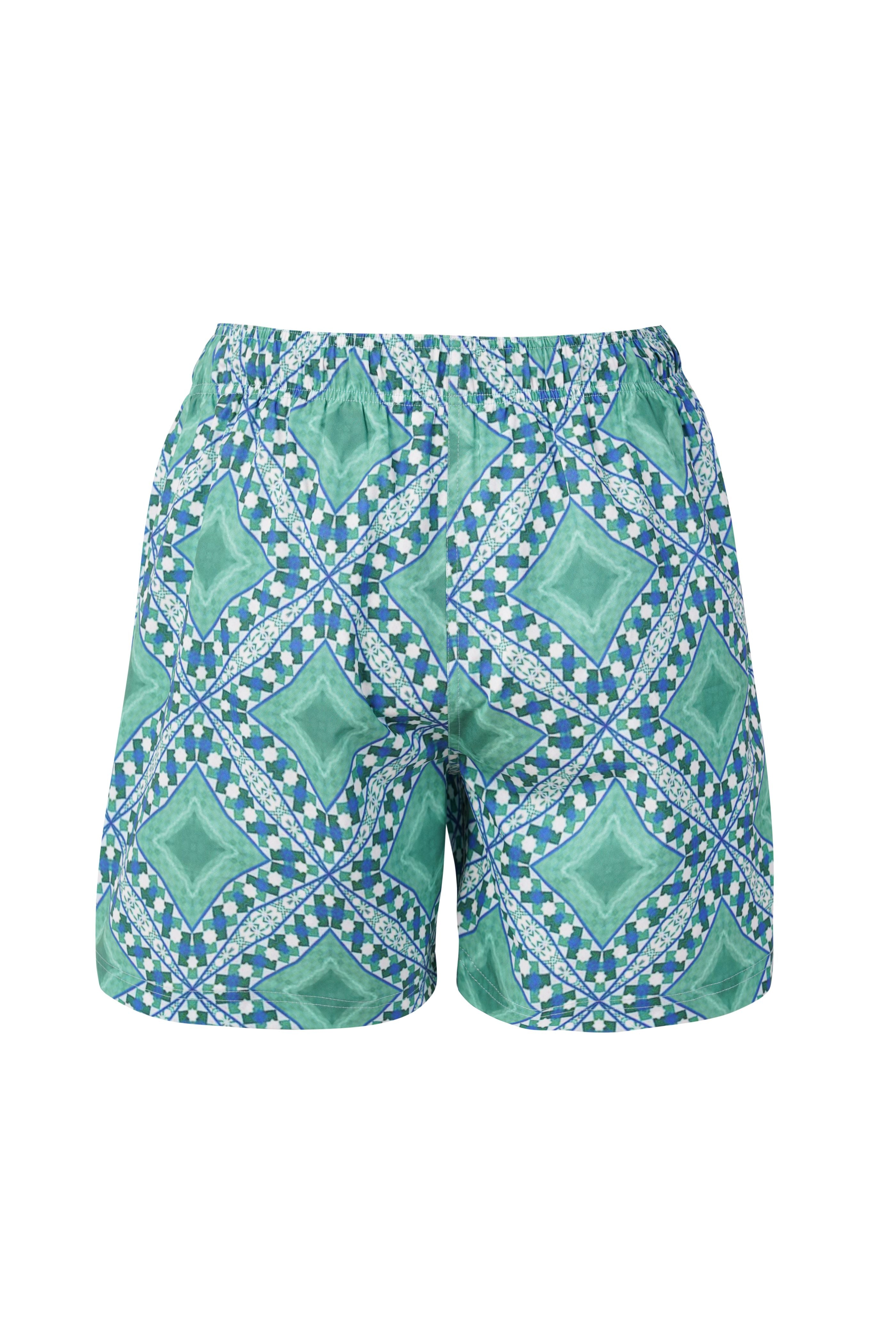 Designer Palermo shorts for men in quick-dry fabric with geometric print, elastic waistband, drawstring and matching family set. Customizable and in plus sizes. Comfortable and lightweight swimwear for holiday outings.