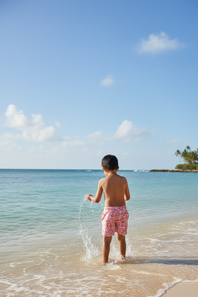 Designer Positano shorts for boys in quick-dry fabric with geometric floral print, elastic waistband, drawstring and matching family set. Customizable and in plus sizes. Comfortable and lightweight swimwear for summers or holiday outings.