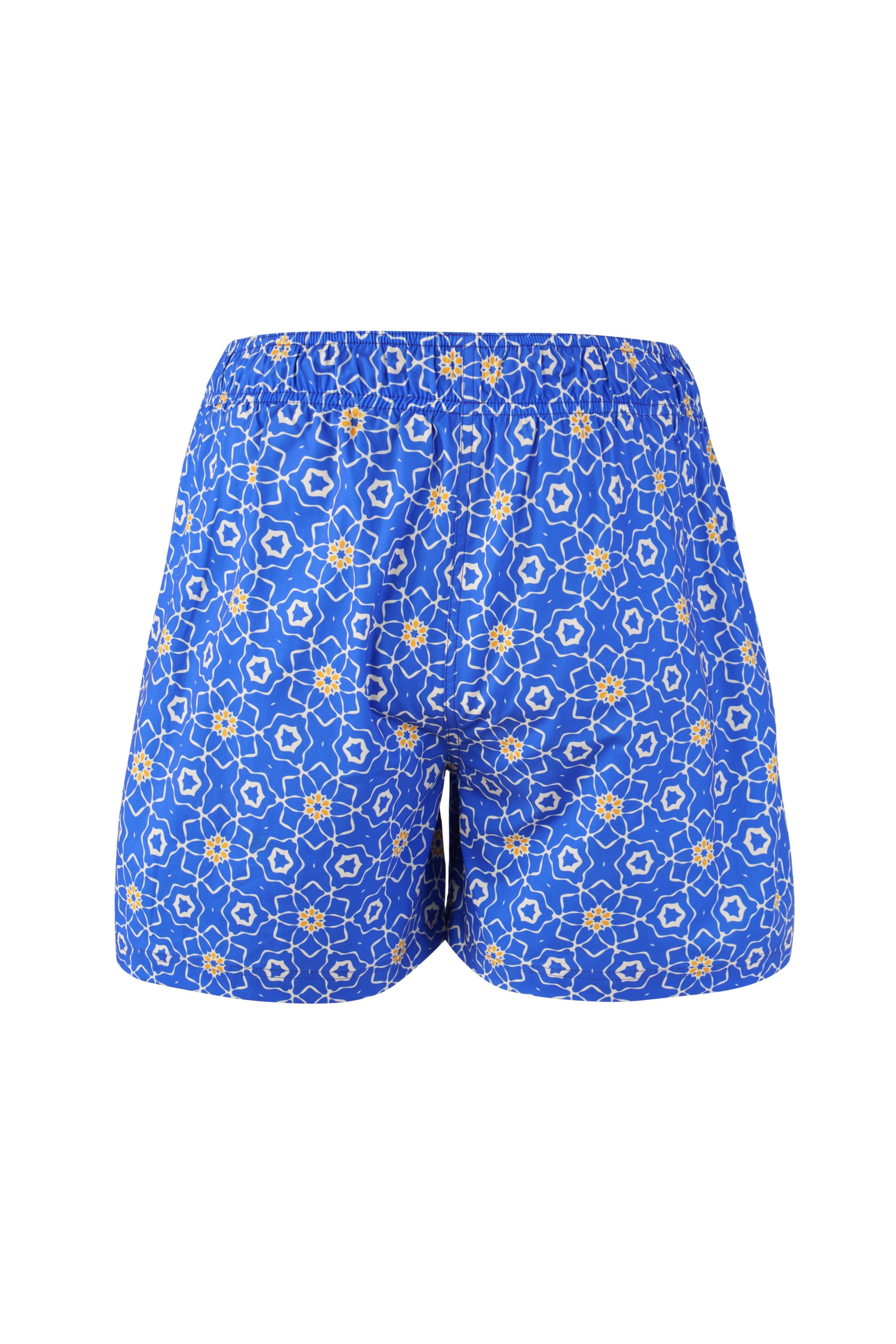 Designer Sorrento boy's swim shorts in floral printed quick-dry fabric with elastic waistband, adjustable drawstring, plus sizes and matching family set. Comfortable kids swimwear for beach and holiday outings.