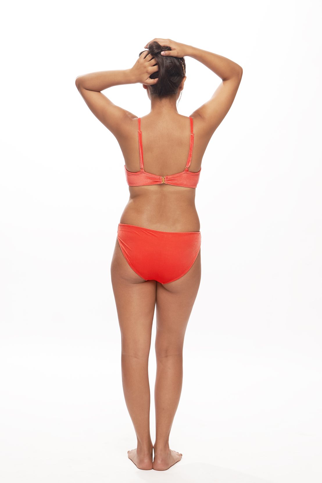 Designer Starfire one-piece swimsuit for women in orange, navy blue and purple with side cut-outs, underwire, in- built cups and an open back with a gold clasp. Customizable, stylish swimwear for sexy summer looks.