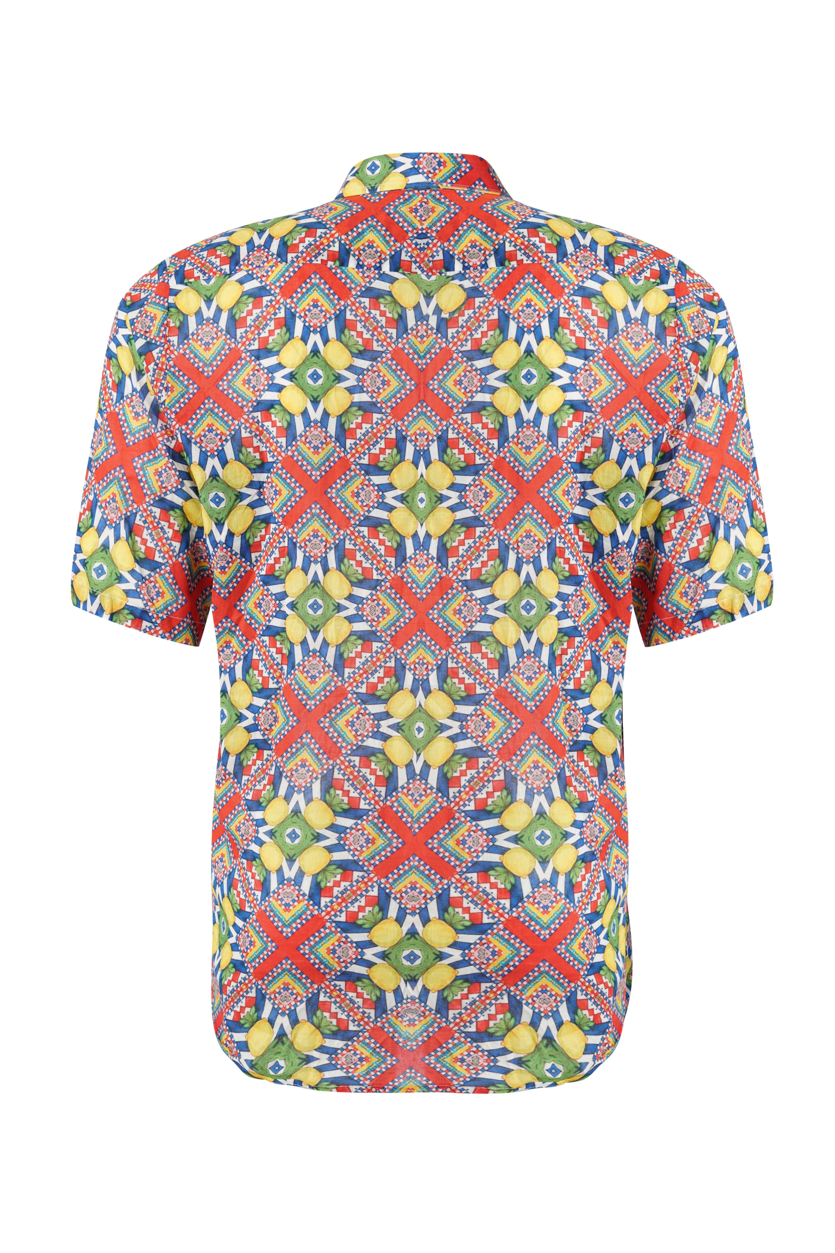 Designer Tuscany beach shirt for men in quick dry sustainable fabric, half sleeves, red geometric print, easy button up, plus sizes and matching family sets. Comfortable, lightweight beachwear and resort wear for summer outings.