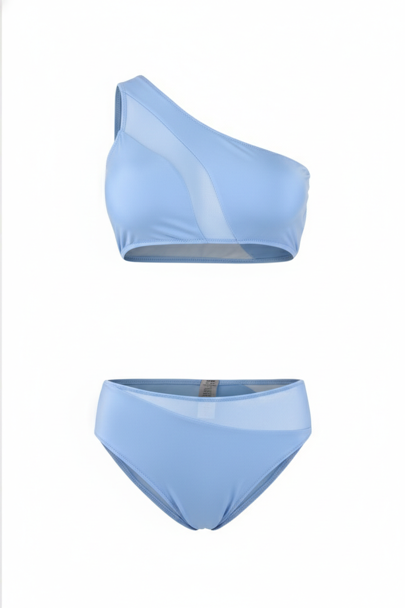 Stylish light blue one-shoulder bikini set with asymmetrical mesh detailing, designed for a bold, modern look perfect for beach days, poolside lounging, and resort wear.