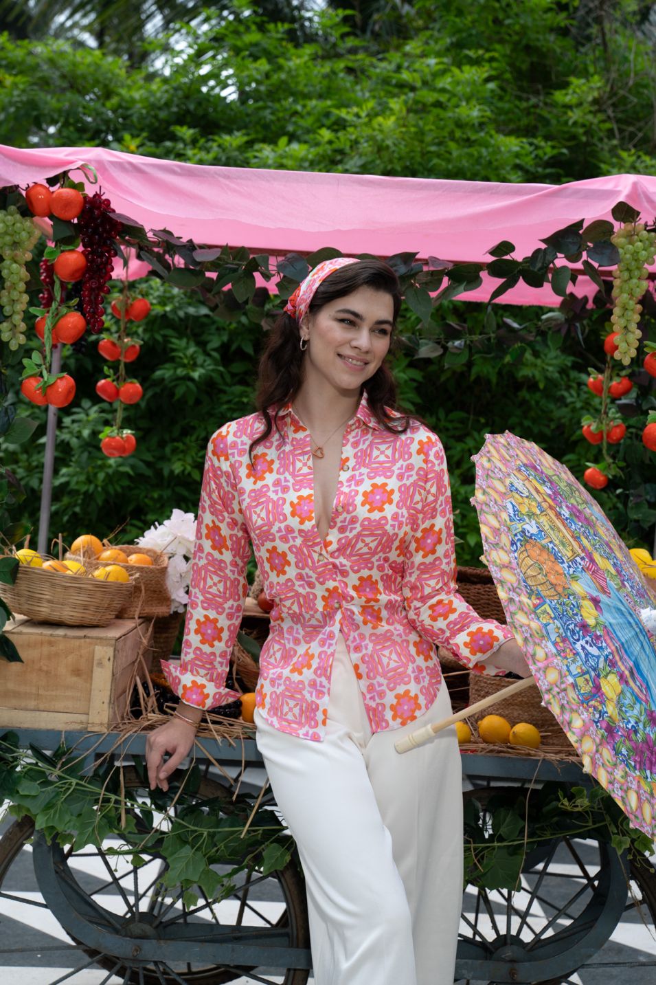 Designer Positano Shirt for women in quick dry sustainable fabric with floral print, long sleeves, back knot, button front closure and family sets. Comfortable, lightweight beachwear and resort wear for summer or holiday outings.