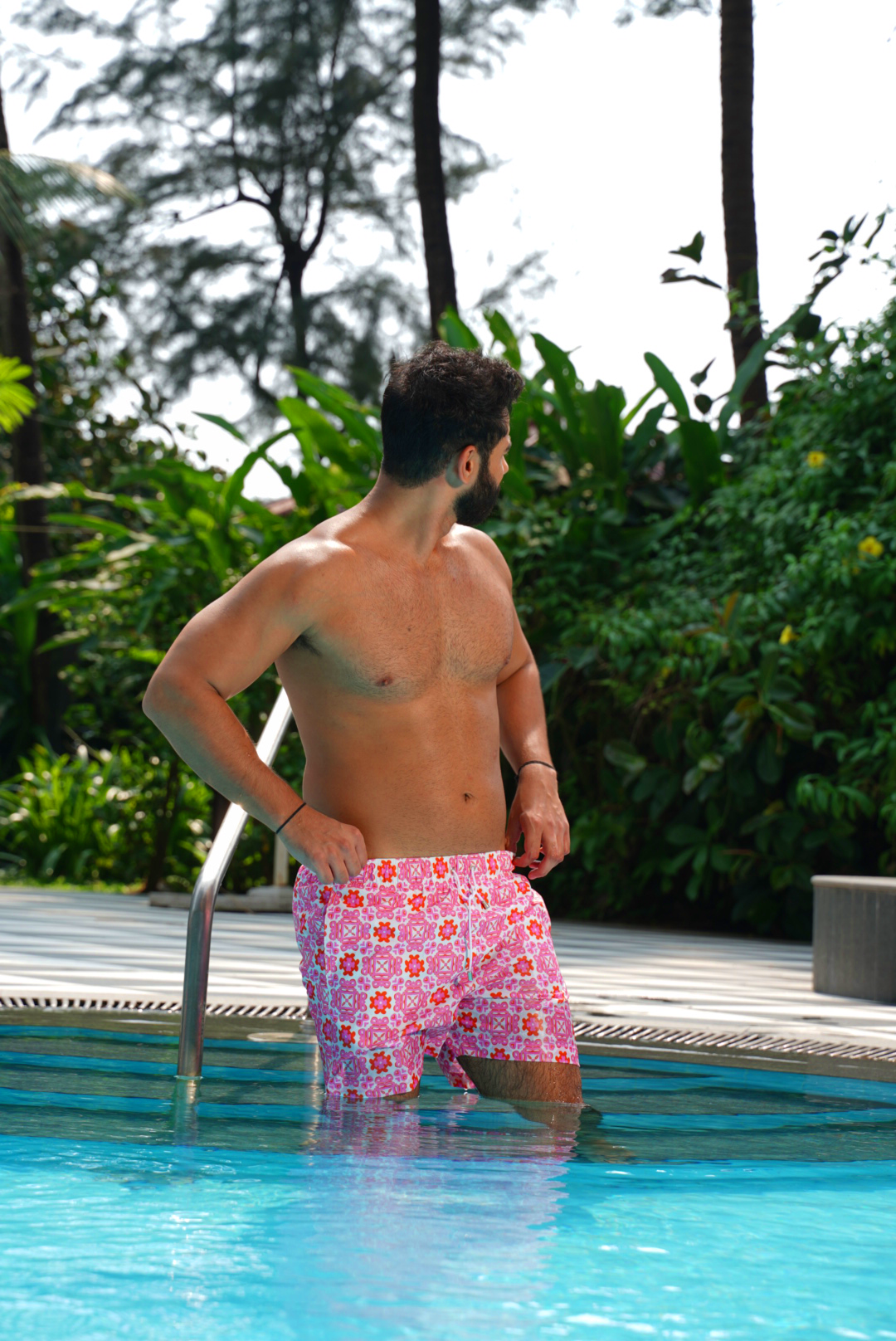 Designer Positano swim shorts for men in quick-dry fabric with geometric floral print, elastic waistband, drawstring and matching family set. Customizable and in plus sizes. Comfortable and lightweight swimwear for summers or holiday outings.