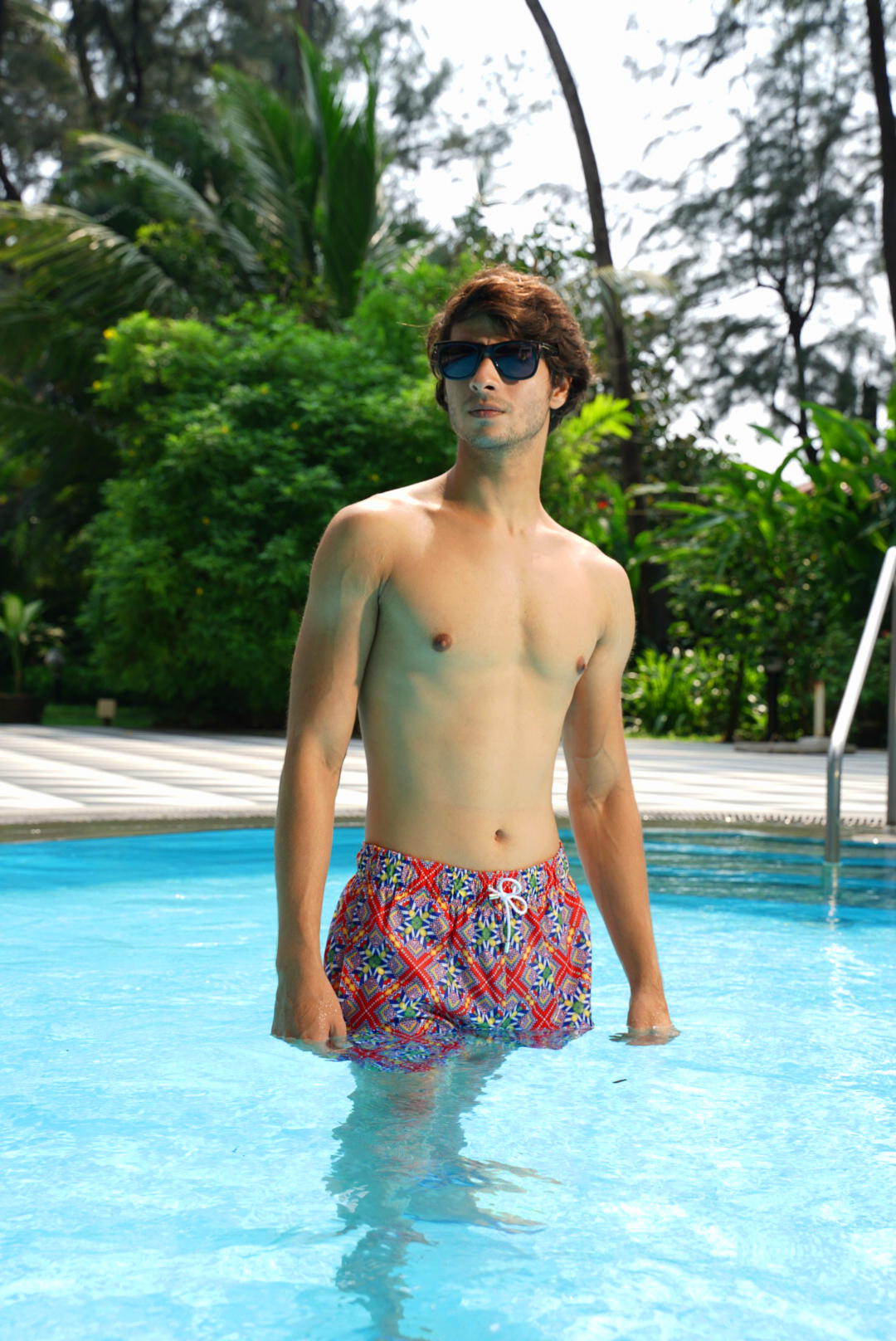 Designer Tuscany men's swim shorts in quick-dry fabric with geometric design, elastic waistband, adjustable drawstring, plus sizes and matching family set. Comfortable swimwear for beach and holiday outings.